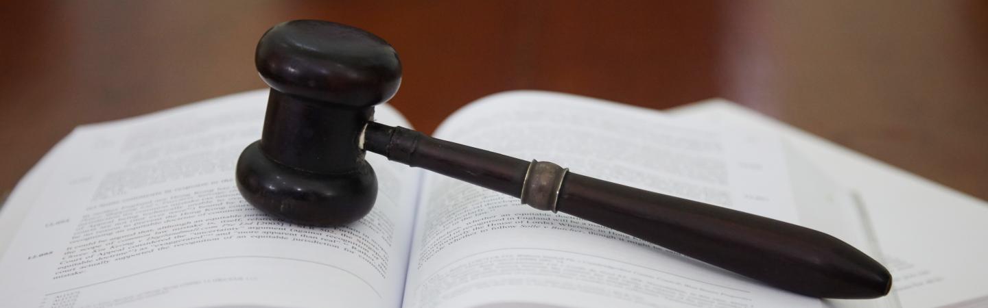 A gavel on a book