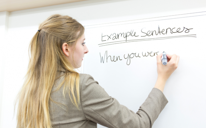 Girl writing on a whiteboard