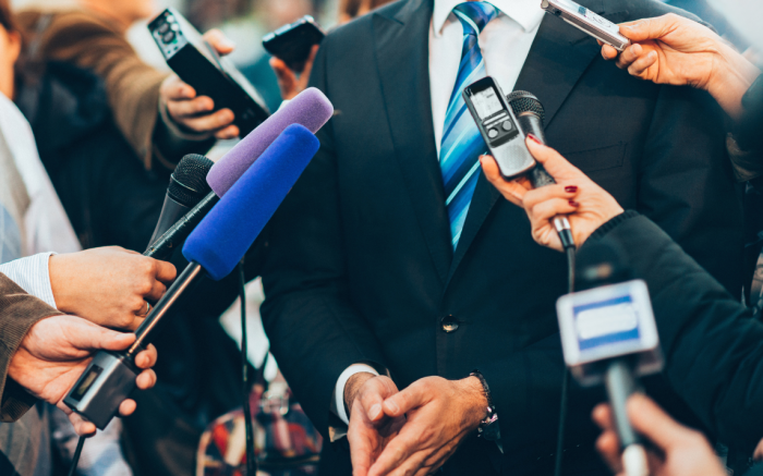 Microphones pointing at person