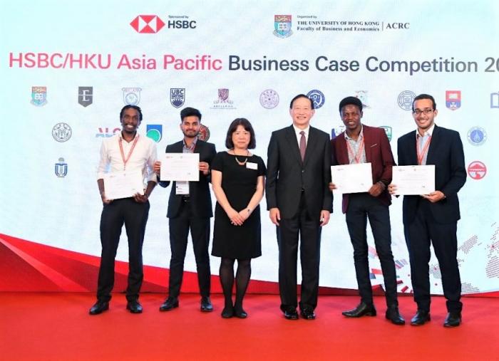 Group of people standing in front of banner for HSBC/HKU Asia Pacific Business Case Competition 