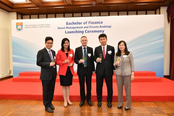 Group of people standing in front of a banner "Bachelor of Finance (Asset Management and Private Banking) Launching Ceremony