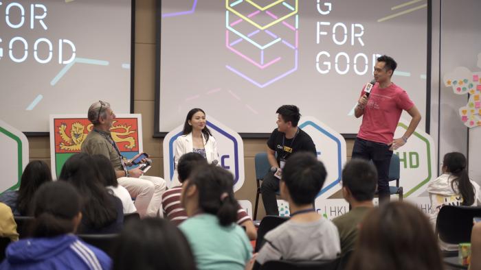 Students listening to a talk from "G for Good"