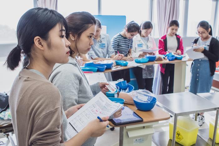 Students looking focused with notes in hand