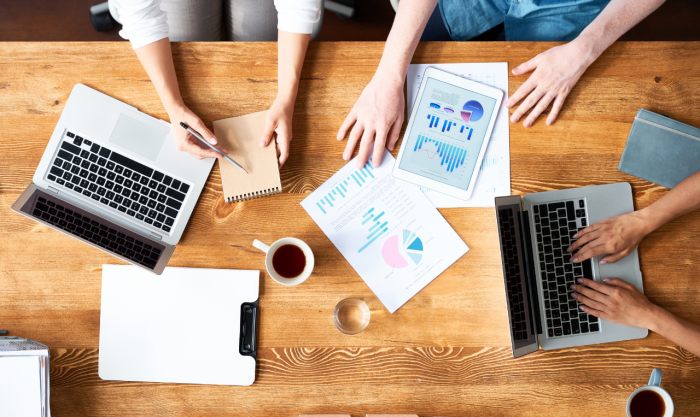 Business people discussing financial documents in meeting