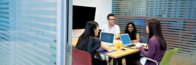 Students discussing in a meeting room