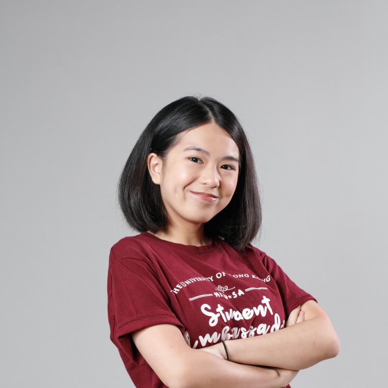 a girl wearing a t-shirt and smiling happily